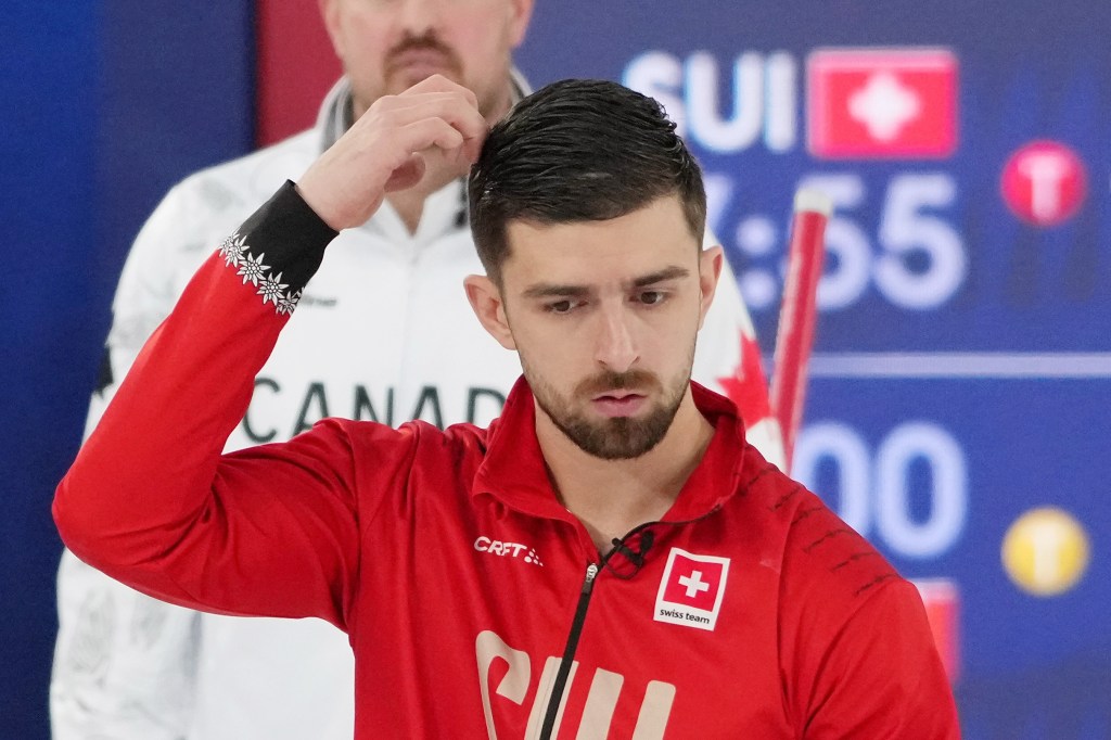 Pablo Lachat-Couchepin of Switzerland reacts during a men's curling round robin game against Canada on Feb. 14, 2026.