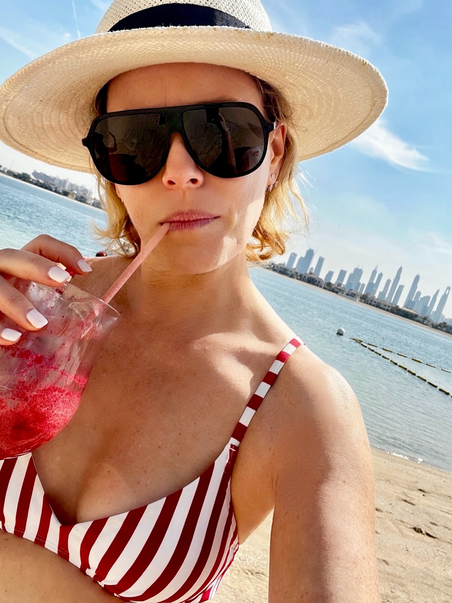 Elizabeth Banks sips a cocktail while in Dubai.