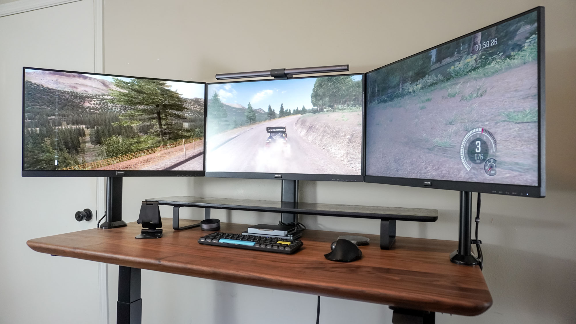 The game Dirt Rally running on a triple monitor setup