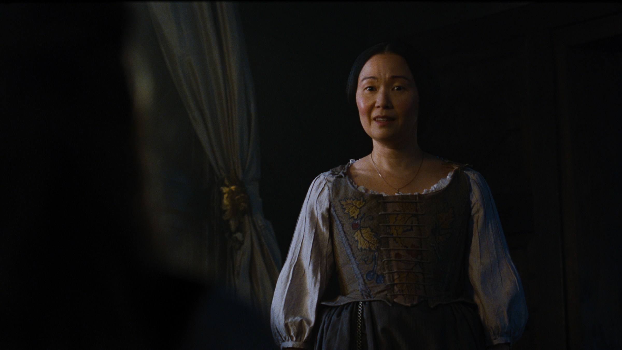 Hong Chua as Nelly Dean in Emerald Fennell’s Wuthering Heights.