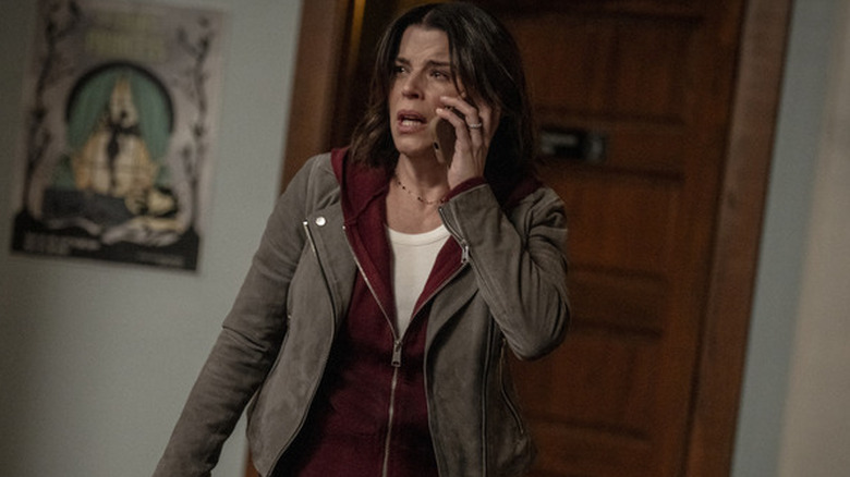 Sidney Prescott holding a phone to her ear in 