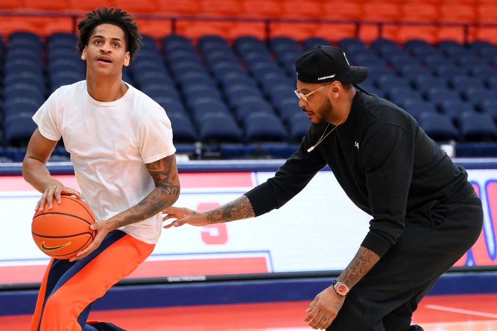 Carmelo Anthony works with son Kiyan Anthony.
