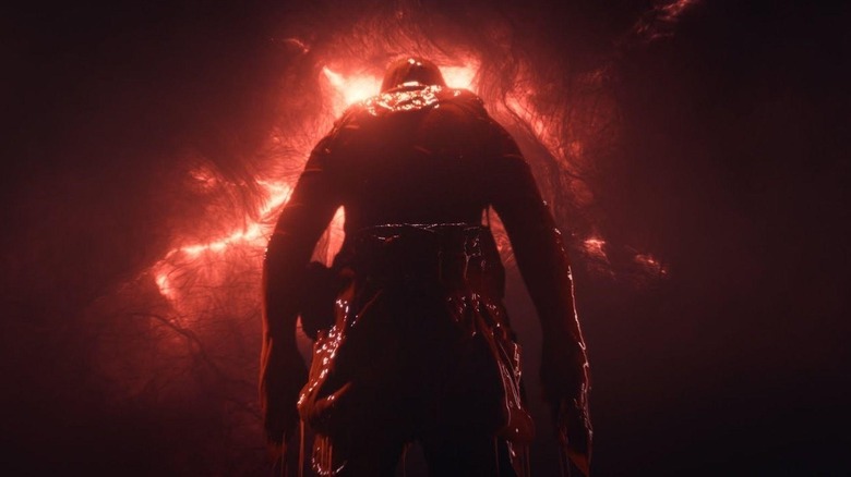 Mark Fischbach as The Convict looking up at a blood red sky in Iron Lung