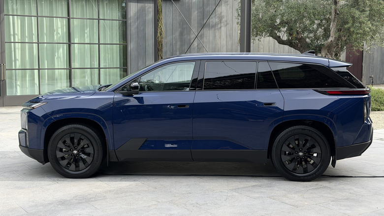 Side view of a blue 2027 Toyota Highlander EV