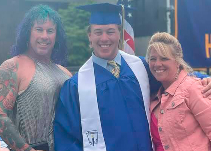 Young graduate smiling with family members, highlighting police discovery about ice rink attacker’s family background.