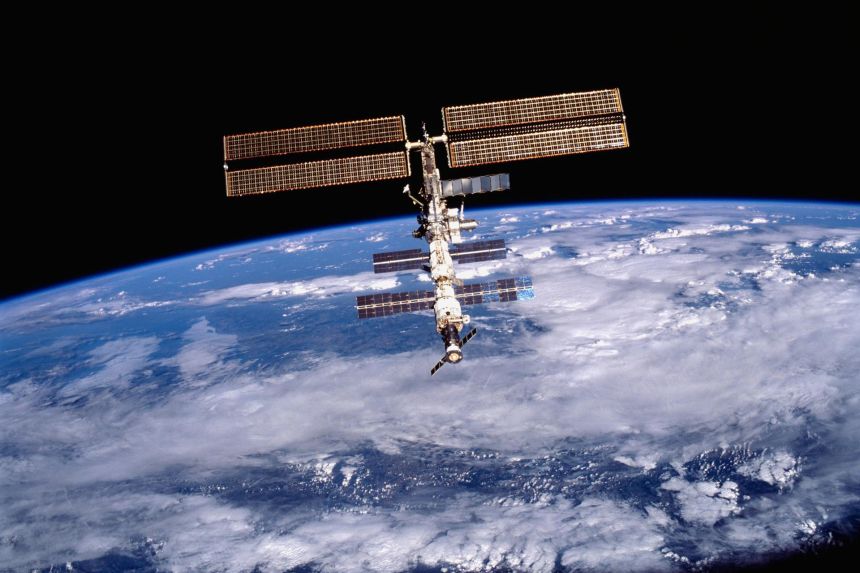 This image of the International Space Station was photographed by one of the crewmembers of the STS-105 mission from the Shuttle Orbiter Discovery after separating from the ISS.