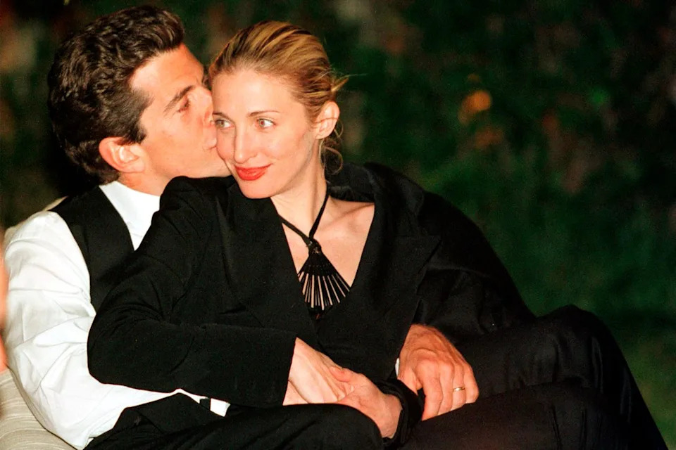 John F. Kennedy, Jr. editor of George magazine, gives his wife Carolyn Bessette a kiss on the cheek during the annual White House Correspondents dinner May 1, 1999 in Washington, DC.Credit: Tyler Mallory / Newsmakers / Liaison Agency