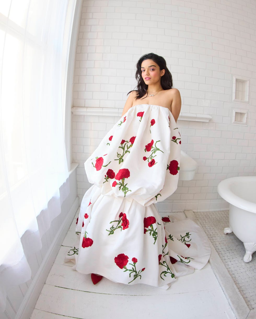 woman in floral dress standing in a bathroom