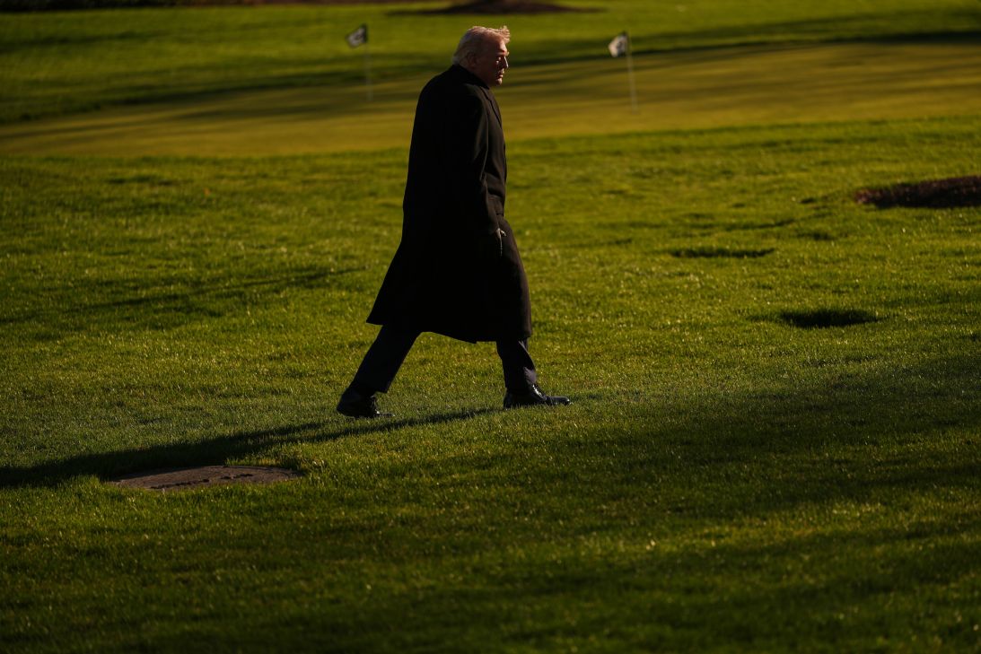 President Donald Trump walks on the South Lawn after arriving on Marine One at the White House, on March 23, in Washington.