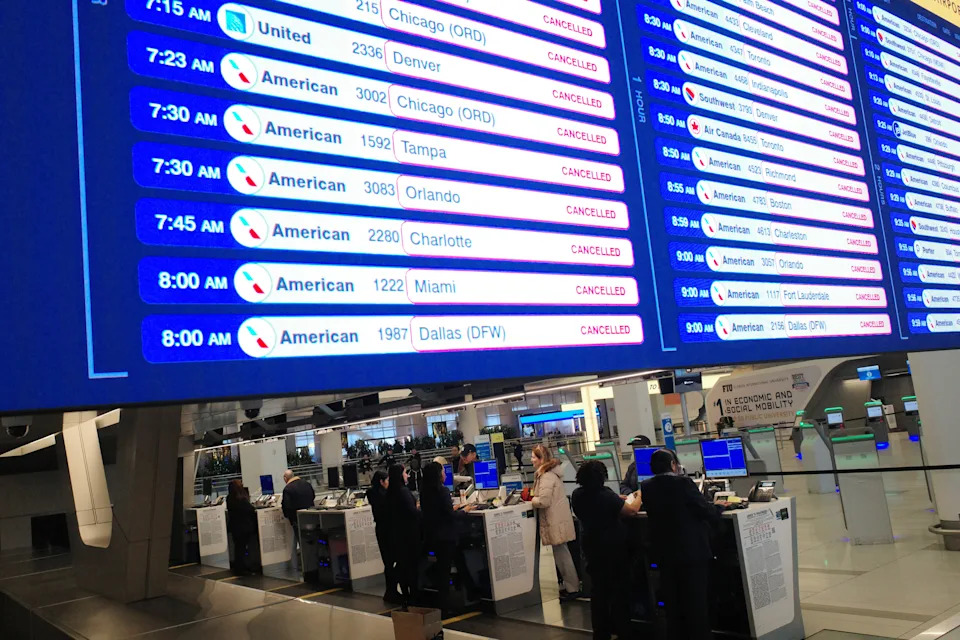 Canceled flights are displayed on a screen at Terminal B in LaGuardia Airport on March 23, 2026, in New York City. 