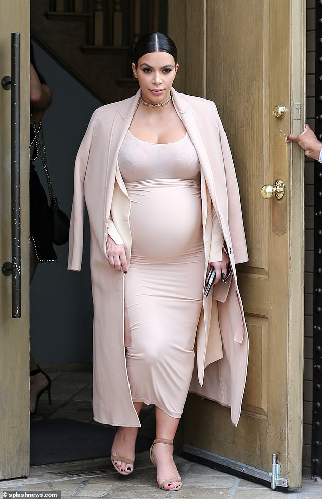 Kim Kardashian welcomed her third and fourth children, Chicago and Psalm, via surrogate in 2018 and 2019 (Kardashian is pictured in 2015 when she was pregnant with her second child, Saint)