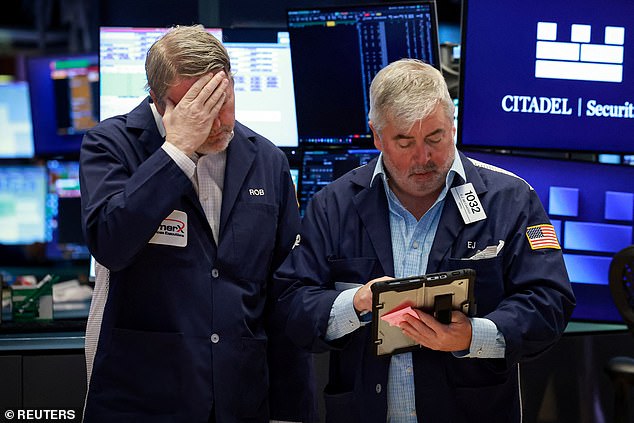 Traders react on the floor of the New York Stock Exchange as markets respond to rising energy prices and uncertainty over the war in Iran