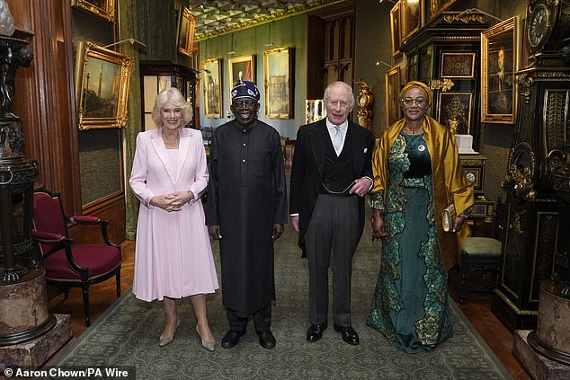 King Charles III and Queen Camilla welcomed President of Nigeria Bola Ahmed Tinubu (second from right) and First Lady Oluremi Tinubu (far right) during an audience in the Grand Corridor at Windsor Castle earlier today