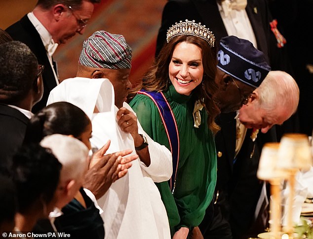  Princess of Wales beams as she shares a toast with the Nigerian President at King Charles’s state banquet