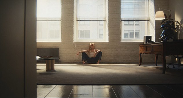 Carolyn is shown retreating from the outside world, a chain-smoking recluse in their Tribeca apartment