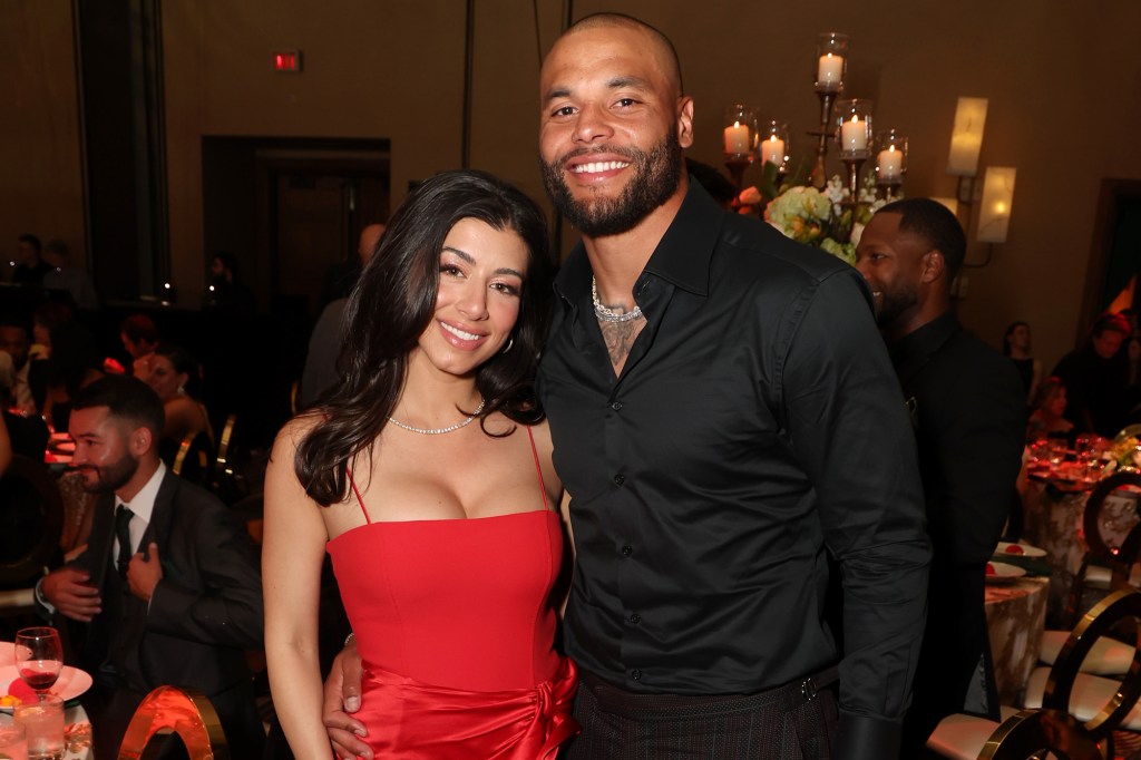 Dak Prescott and Sarah Jane Ramos smiling.