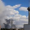 A plume of smoke rises following reported explosions in Tehran on March 1, 2026.