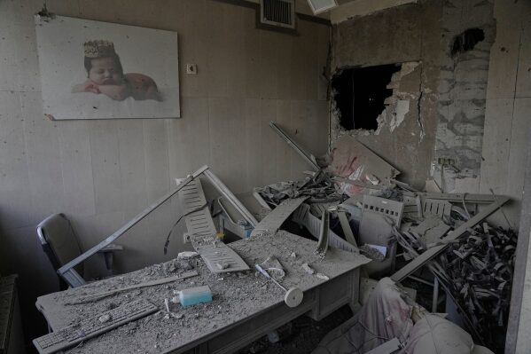 Debris is seen in a room of the Gandhi Hospital, which was damaged when a strike hit a state TV communications tower and nearby buildings across the street, during the ongoing joint U.S.-Israeli military campaign in Tehran, Iran, Monday, March 2, 2026. (AP Photo/Vahid Salemi)