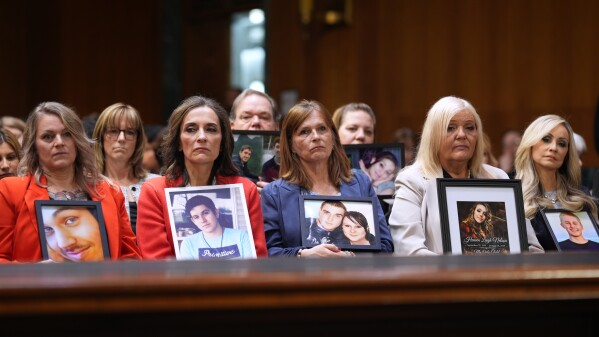 Angel Moms, parents whose children have died because of illegal immigrants, listen as Homeland Security Secretary Kristi Noem appears for an oversight hearing before the Senate Judiciary Committee, at the Capitol in Washington, Tuesday, March 3, 2026. (AP Photo/J. Scott Applewhite)