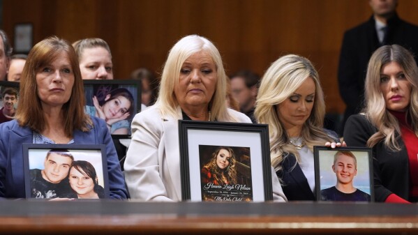 Angel Moms, parents whose children have died because of illegal immigrants, listen as Homeland Security Secretary Kristi Noem appears for an oversight hearing before the Senate Judiciary Committee, at the Capitol in Washington, Tuesday, March 3, 2026. (AP Photo/J. Scott Applewhite)