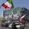 People wave flags in mourning of the slain Ayatollah Ali Khamenei during the U.S.-Israeli military campaign in Tehran, Iran, on Wednesday. The Iranian authorities ultimately postponed public mourning rituals for the supreme leader.