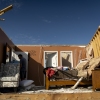 A person walks through a house in the community of Sunshine Hills outside of London, Kentucky. A tornado struck the neighborhood of Sunshine Hills just after midnight on May 17, 2025 in London, Kentucky. (Photo by Michael Swensen/Getty Images)
