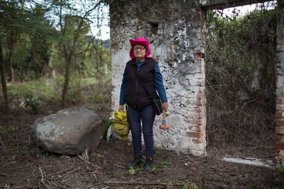 Hilaria Arzaba Medran, 57, poses for a photo with tools as she searches for her disappeared son and other victims in a location known to have been a clandestine grave. Ilaria's son Oscar Contreras Arzaba disappeared on May 22, 2011, at the age of 19. Ilaria is a member of Solecito, an organization of more than 250 family members with numerous chapters throughout the State of Veracruz, who go out and search for their missing relatives nearly on a daily basis. Cordoba, Veracruz, Mexico. February 20, 2018. James Rodríguez / Everyday Latin America Reason for selection: “Women risking their lives in search of their loved ones is a common theme in the work I do. Yet it never ceases to amaze me.” Published in Le Monde: https://www.lemonde.fr/international/portfolio/2018/06/22/tous-les-maux-du-mexique-reunis-au-veracruz_5319874_3210.html