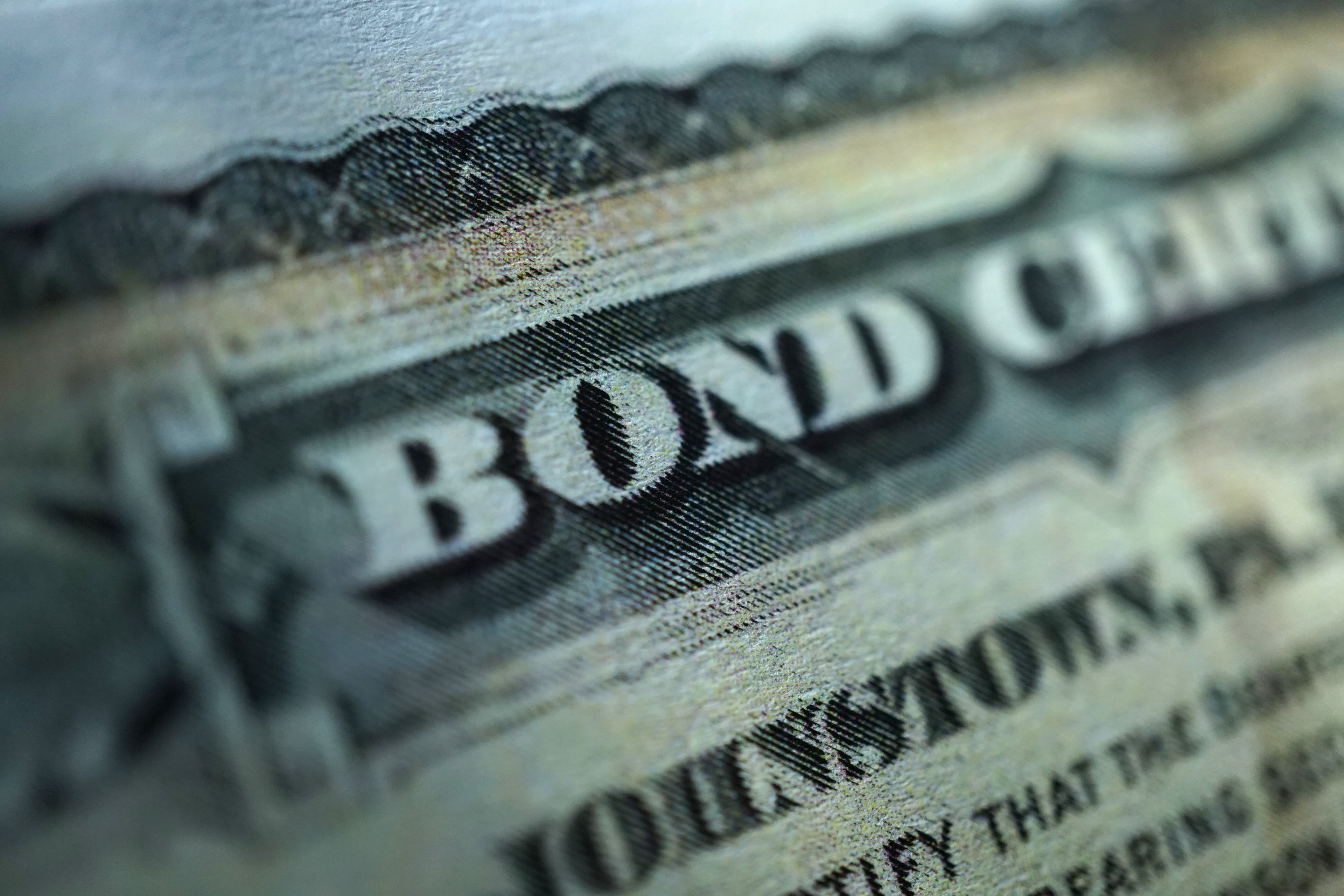 An up-close view of a paper government bond certificate.