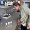 Inside a lab at the University of Utah, Sydney Peterson inspects containers of fruit flies. As part of her doctoral research, the Paralympian is using fruit flies to test the effectiveness of different drugs on certain genetic movement disorders.