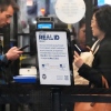 A Real ID sign is displayed as travelers wait to go through security check point at O'Hare International Airport in Chicago, May 23, 2025.