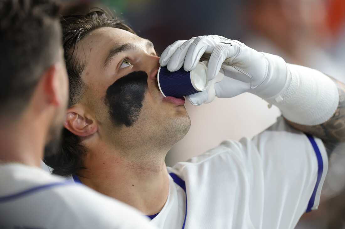 Andrew Fischer of Team Italy drinks a shot of espresso while celebrating his solo home run against Great Britain during a 2026 World Baseball Classic Pool B game on March 08, 2026 in Houston, Texas.