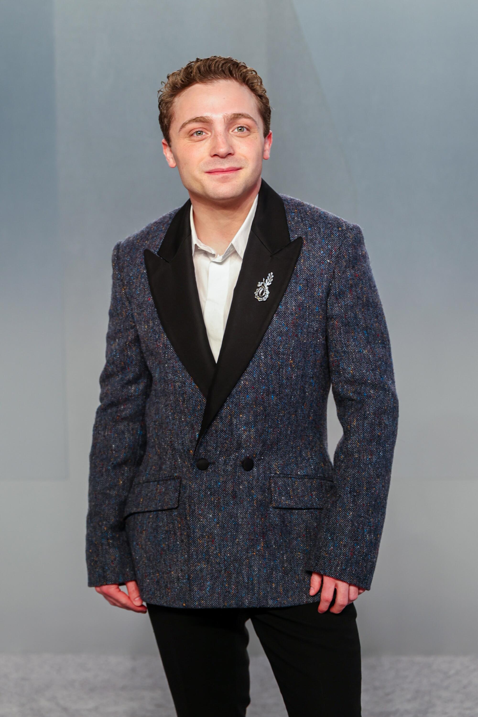 Jake Shane poses on the red carpet. 