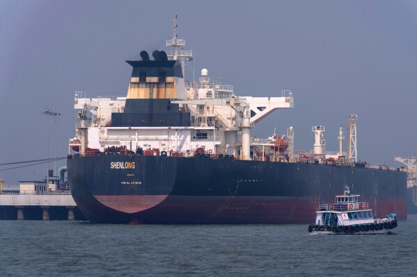Liberia-flagged tanker Shenlong Suezmax, carrying crude oil from Saudi Arabia, that arrived clearing the Strait of Hormuz, is seen at the Mumbai Port in Mumbai, India, Thursday, March 12, 2026. (AP Photo/Rafiq Maqbool, File)