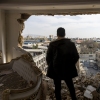 TEHRAN, IRAN - MARCH 14: A man stands in a damaged residence on March 14, 2026 at the site of buildings, including a police station, that were destroyed in an airstrike two days ago in the Khani Abad neighbourhood of Tehran, Iran. According to authorities, the police station was empty at the time of the attack but six civilians were killed. The United States and Israel have continued a campaign of air strikes in Iran after launching their joint war on the country on February 28.(Photo by Majid Saeedi/Getty Images)