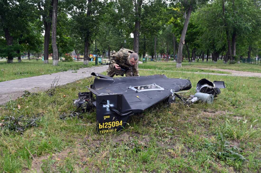 A Ukrainian explosives expert examines parts of a Shahed-136 military drone that fell down following an air-attack in Kharkiv on June 4, 2025, amid the Russian invasion of Ukraine. (Photo by SERGEY BOBOK / AFP via Getty Images)
