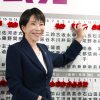Sanae Takaichi, Japan's prime minister and president of the ruling Liberal Democratic Party (LDP), puts pins marking the names of candidates who won lower house elections at the LDP headquarters Sunday, Feb. 8, 2026 in Tokyo. 