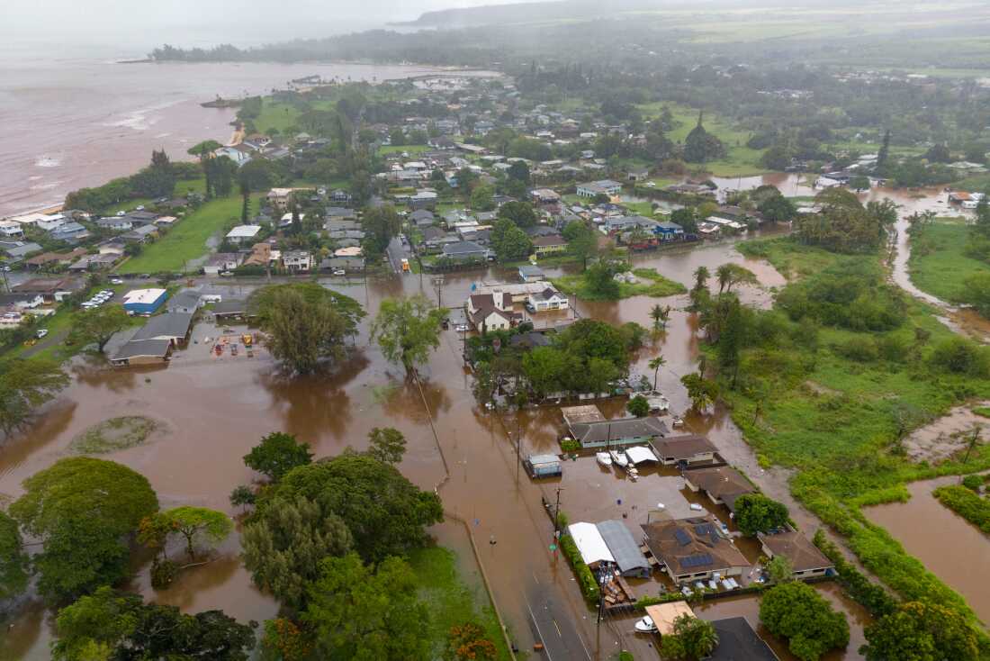Streets are flooded from severe rains Friday in Haleiwa, Hawaii.