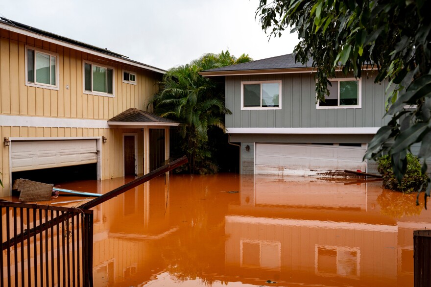 Floodwaters fill the ground level of homes in Waialua, Hawaiʻi, Friday, March 20, 2026.