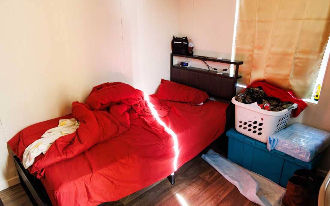 Matthew Stone’s sleeping cabin has a bed, an alarm clock and a place for his belongings.