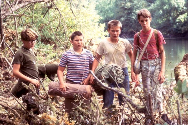 This image released by Sony Pictures shows Corey Feldman, from left, Jerry O'Connell, River Phoenix, Wil Wheaton in a scene from "Stand by Me." (Sony Pictures via AP)