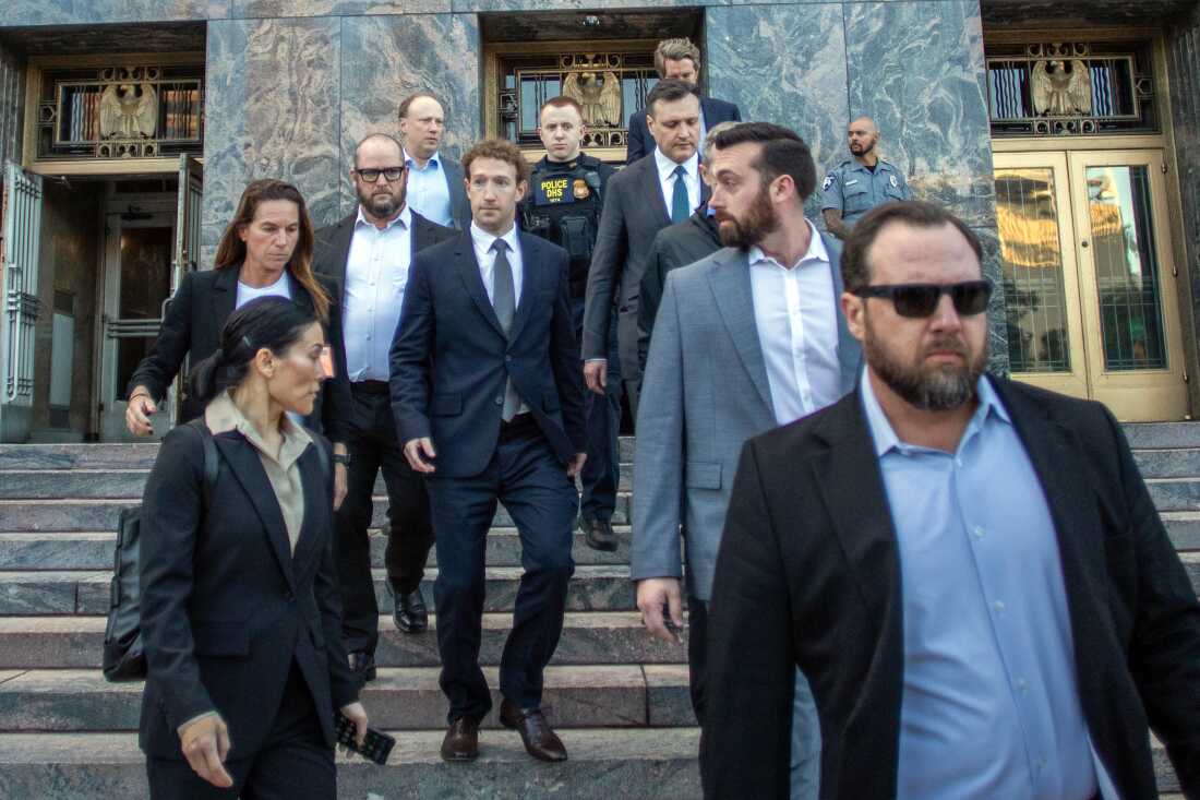 Meta CEO and Chairman Mark Zuckerberg (center) leaves the Los Angeles Superior Court after testifying in the social media trial on Feb. 18, 2026.
