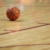 A basketball sits on the court during the first half of an NCAA college basketball game Jan. 21 in Ames, Iowa.