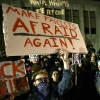 A protester holds a sign that reads "Make Fascists Afraid Again!" during a demonstration at the University of Washington on Jan. 20, 2017, in Seattle.