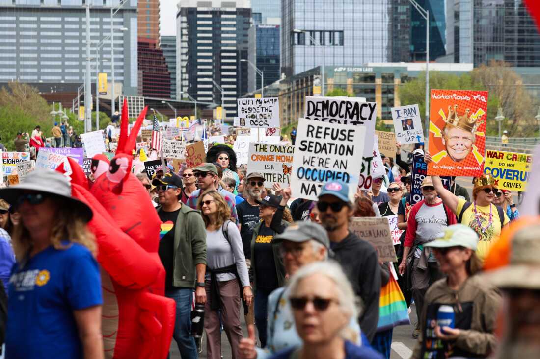 A large crowd marches across the South First bridge toward a gathering for the No Kings protest at Auditorium Shores in Austin, Texas, on Saturday, March 28, 2026. Patricia Lim / KUT News