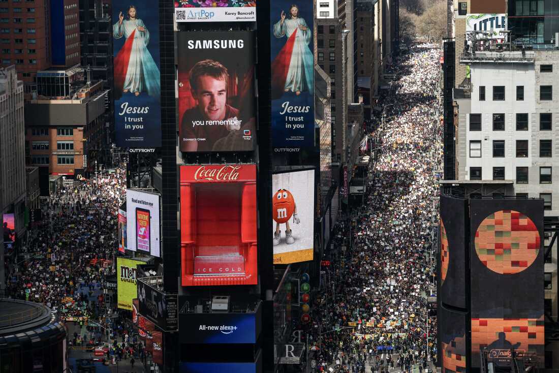 Protesters descend on Times Square during the "No Kings" national day of protest in New York on March 28, 2026. Nationwide protests against US President Donald Trump are expected Saturday as millions of people vent fury over what they see as his authoritarian bent and other forms of cruel, law-trampling governance. It is the third time in less than a year that Americans will take to the streets as part of a grassroots movement called "No Kings," the most vocal and visual conduit for opposition to Trump since he began his second term in January 2025. (Photo by CHARLY TRIBALLEAU / AFP via Getty Images)