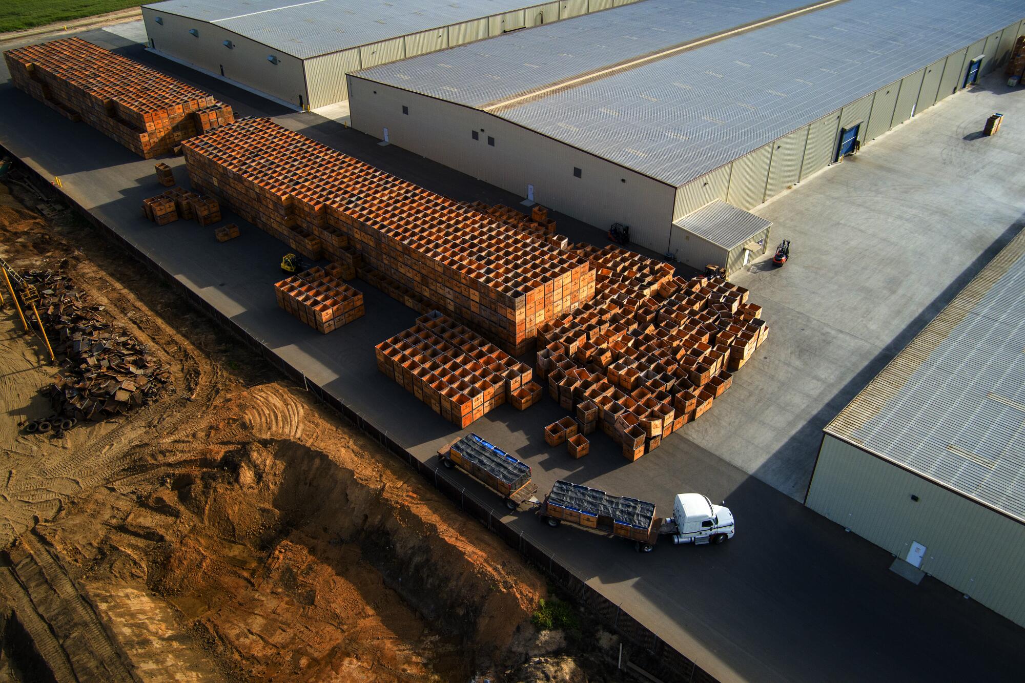 A driver hauls almonds in a tractor trailer