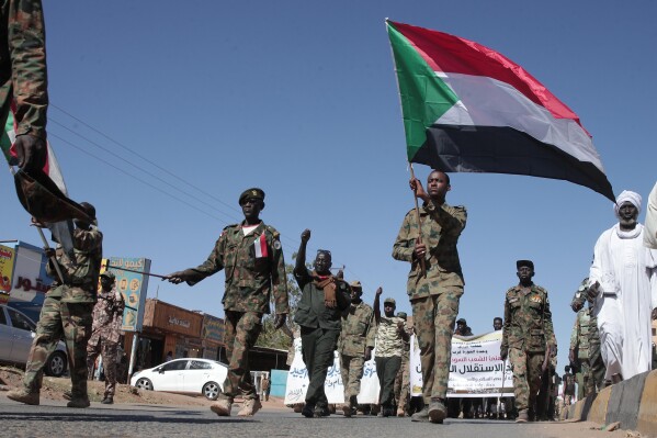 Sudanese army soldiers parade in the streets of Omdurman, a district of Khartoum, Sudan, Wednesday, Dec. 31, 2025, to mark the 70th anniversary of the Sudan Independence. (AP Photo/Marwan Ali)