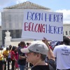 Jenny Harris, of Baltimore, protests in support of birthright citizenship and the immigrant community, May 15, 2025, outside of the Supreme Court in Washington.