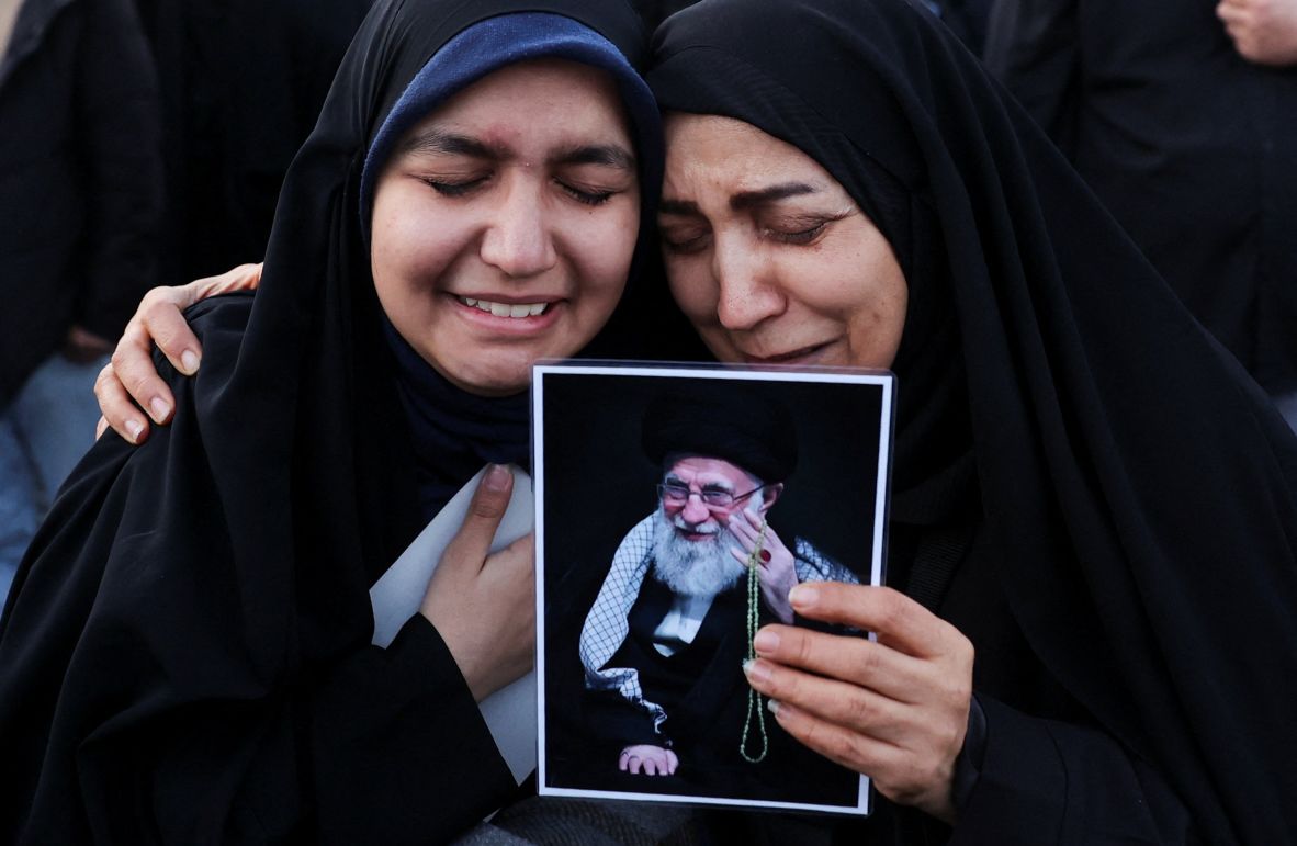 People hold a picture of Iran's supreme leader, Ayatollah Ali Khamenei, as they gather at Enghelab Square in Tehran on March 1.