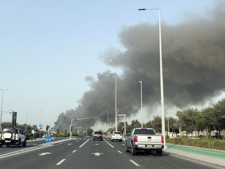 Smoke billows from Zayed port after an Iranian attack, 